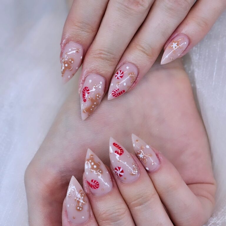 Nude stiletto nails with red floral nail art in Edmonton nail salon